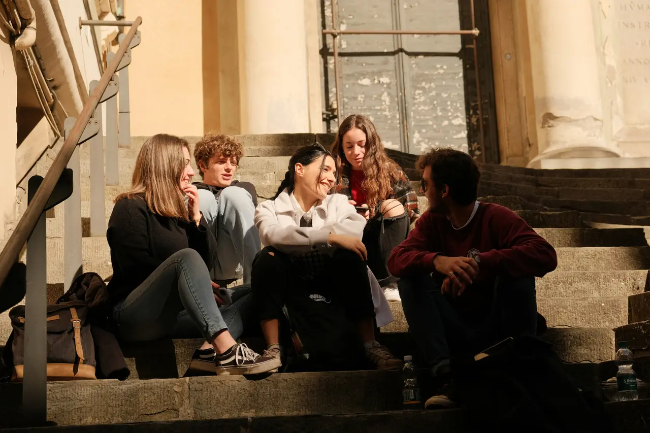 Friends chatting on stone steps